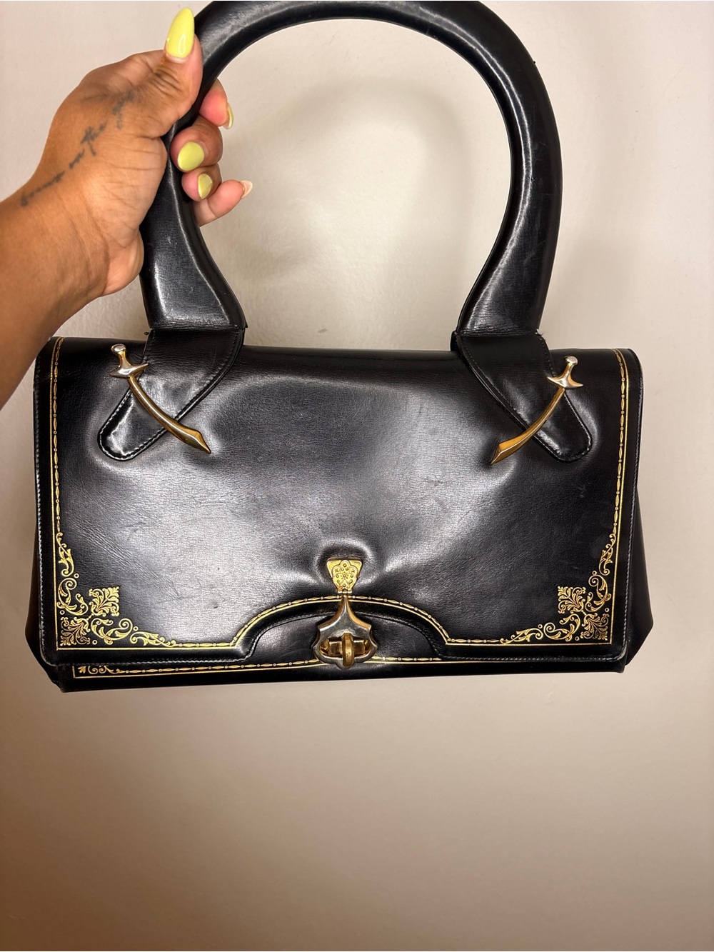 Classic Black Handbag with Gold Accents